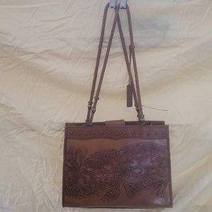 Western leather tooled handbag. Braided leather handles brass hardware